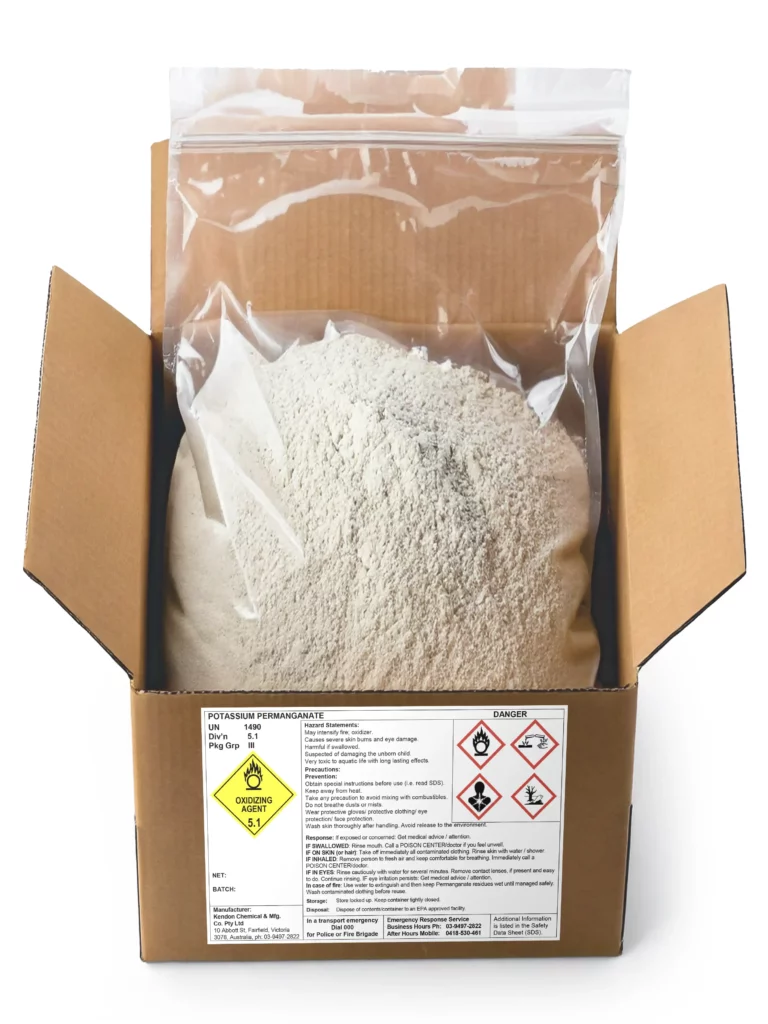 Product shot of Potassium Permanganate powder in a labelled and open cardboard box