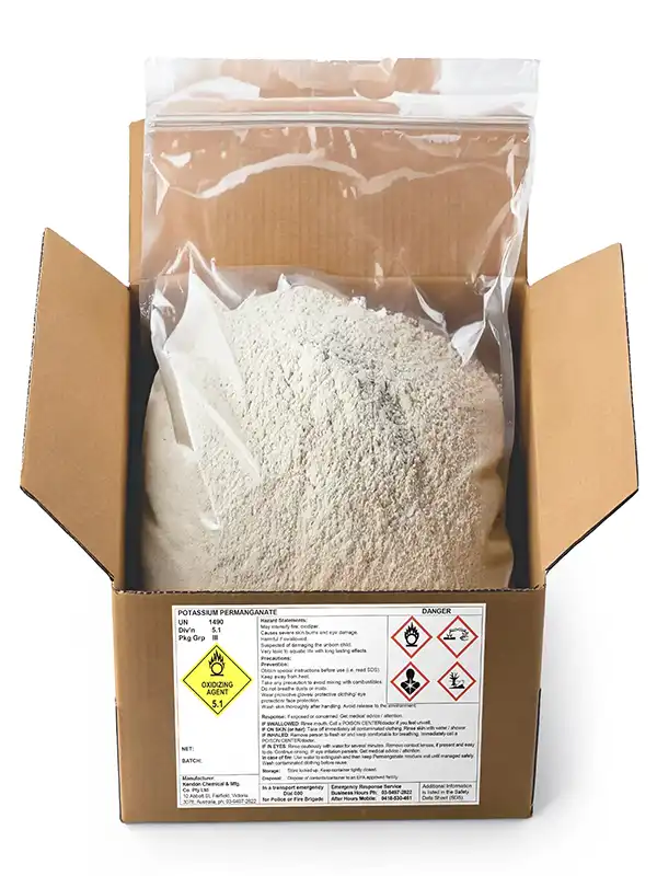 Product shot of Potassium Permanganate powder in a labelled and open cardboard box